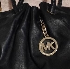 Michael Kors Black Leather Drawstring Shoulder Bag with Gold Logo Charm